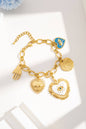 Gold-plated stainless steel symbolic charm bracelet — hand, heart
