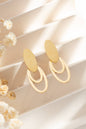 Modern oval earrings in gold- and silver-toned steel: Or jaune