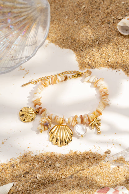 Beaded bracelet with natural shells, charms, stainless steel