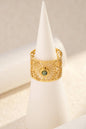 Openwork gold ring adorned with adjustable natural stone