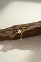 Refined ring with dangling crystal pearl in gold stainless steel