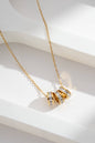 Women's stainless steel necklace – triple golden crystal ring: Or jaune