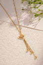 Golden butterfly necklace in stainless steel with tassels