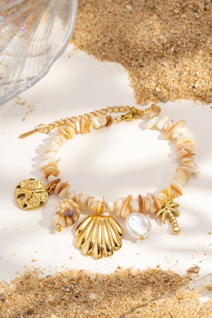 Beaded bracelet with natural shells, charms, stainless steel