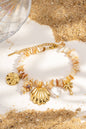 Beaded bracelet with natural shells, charms, stainless steel